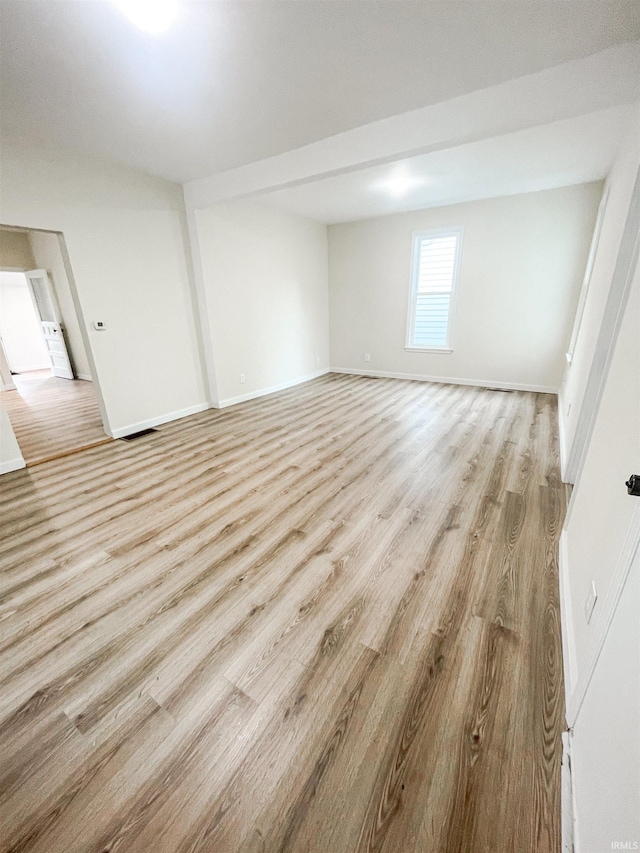 511 E 3rd St, Peru, IN 46970 - unfurnished room with light wood-style flooring and baseboards