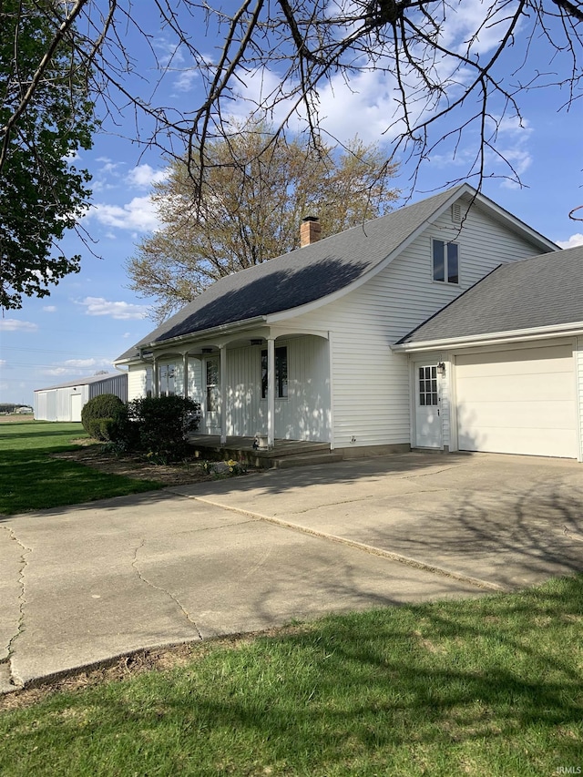 6921 Franke Rd, Fort Wayne, IN 46816 - view of front of house with a chimney, a garage, roof with shingles, and concrete driveway