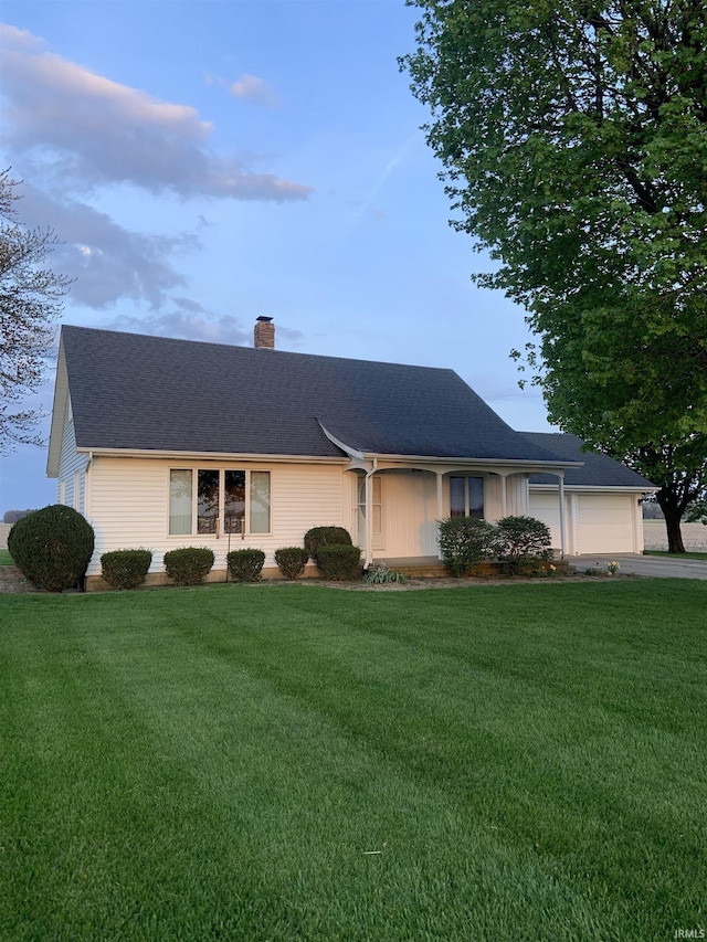 6921 Franke Rd, Fort Wayne, IN 46816 - single story home with a chimney, driveway, a front yard, roof with shingles, and a garage
