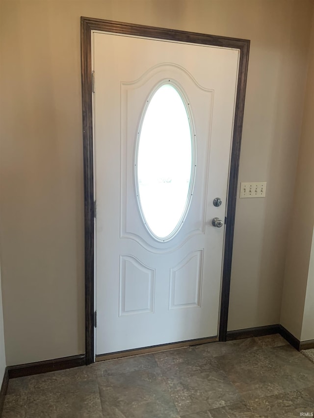 6921 Franke Rd, Fort Wayne, IN 46816 - foyer entrance with baseboards and dark stone finish floors