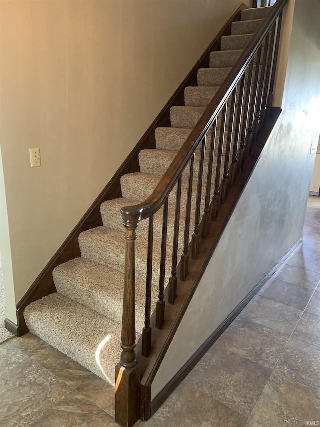 6921 Franke Rd, Fort Wayne, IN 46816 - stairway featuring baseboards and stone finish flooring