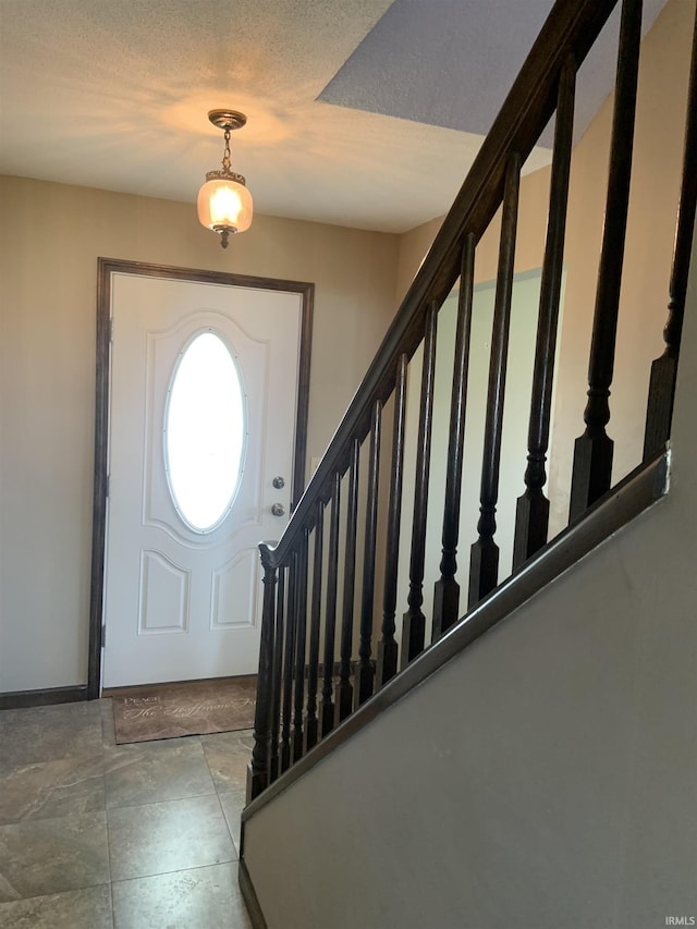 6921 Franke Rd, Fort Wayne, IN 46816 - foyer entrance featuring stairway and baseboards