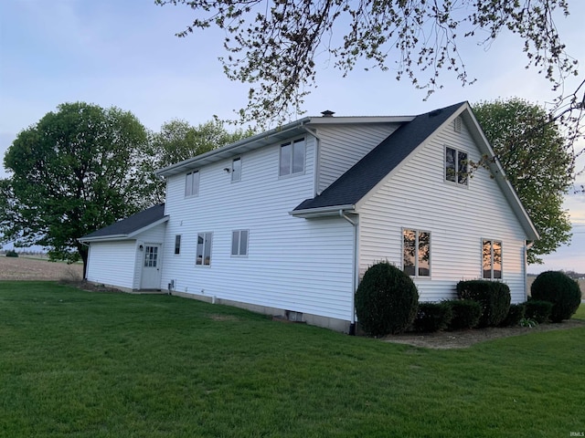 6921 Franke Rd, Fort Wayne, IN 46816 - view of side of home with a yard and roof with shingles