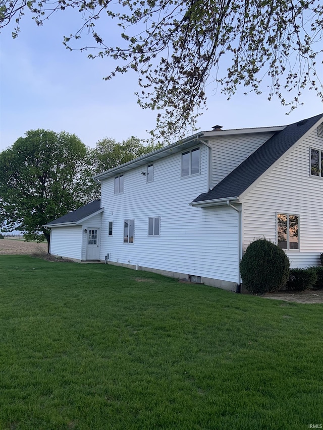 6921 Franke Rd, Fort Wayne, IN 46816 - rear view of property featuring a lawn and roof with shingles