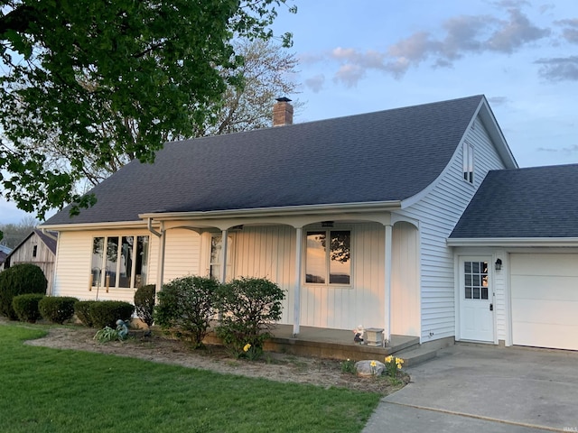 6921 Franke Rd, Fort Wayne, IN 46816 - view of front of property with an attached garage, a chimney, a porch, concrete driveway, and a shingled roof