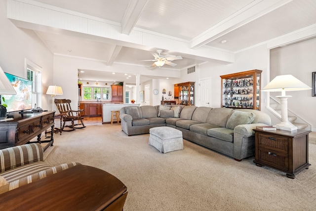 6592 E Waco Dr, Syracuse, IN 46567 - living area with light colored carpet, beam ceiling, and a ceiling fan
