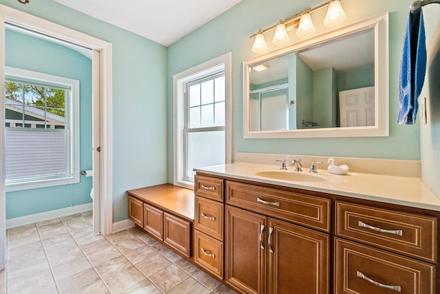 6592 E Waco Dr, Syracuse, IN 46567 - full bathroom featuring plenty of natural light, vanity, an enclosed shower, and baseboards