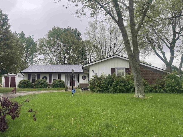 5434 Lawford Ln, Fort Wayne, IN 46815 - view of front of house featuring a front yard and board and batten siding