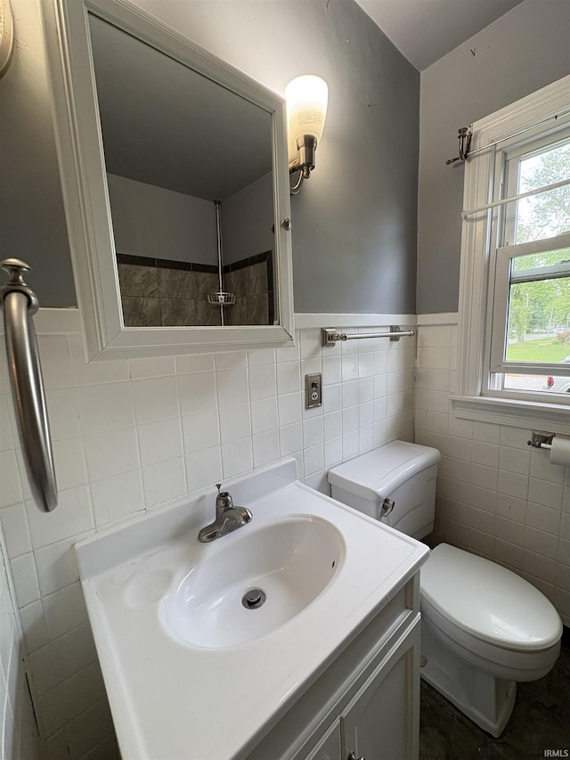 1713 E Illinois St, Evansville, IN 47711 - bathroom featuring tile walls, toilet, wainscoting, and vanity