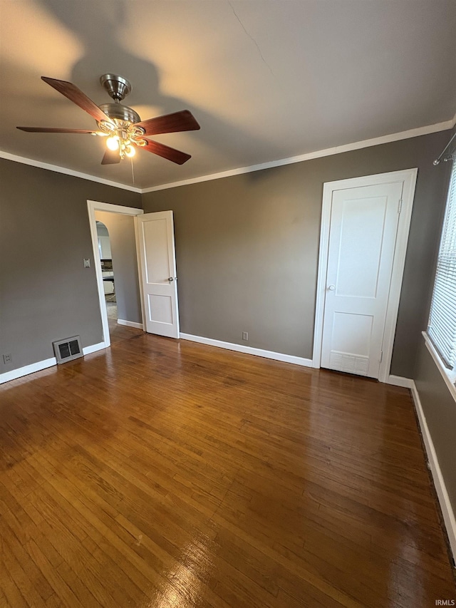 1713 E Illinois St, Evansville, IN 47711 - spare room featuring ceiling fan, ornamental molding, baseboards, and wood finished floors