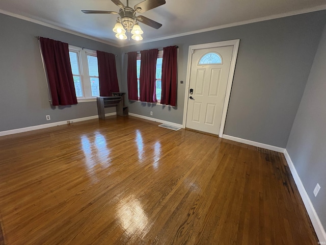 1713 E Illinois St, Evansville, IN 47711 - foyer entrance featuring ceiling fan, wood finished floors, baseboards, and ornamental molding