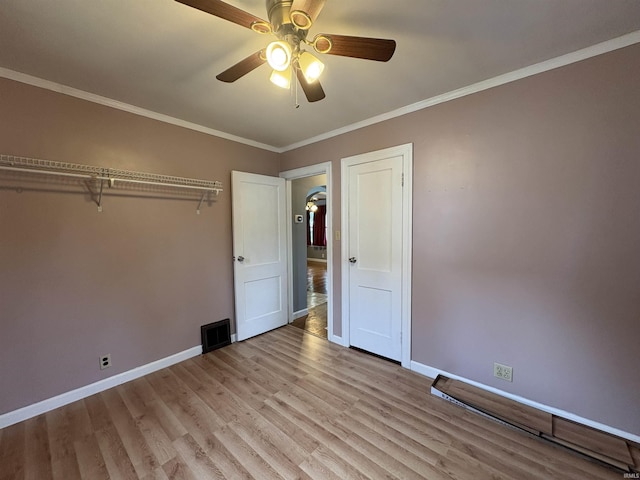 1713 E Illinois St, Evansville, IN 47711 - unfurnished bedroom with light wood-style flooring, baseboards, ornamental molding, and a ceiling fan