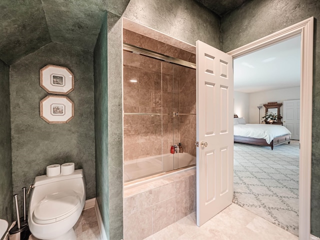 703 Pfeiffer Rd, Evansville, IN 47711 - ensuite bathroom featuring tiled shower / bath, toilet, and tile patterned floors