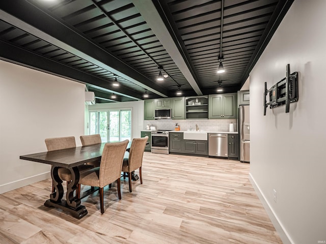 703 Pfeiffer Rd, Evansville, IN 47711 - dining room with wet bar, baseboards, light wood-type flooring, and rail lighting