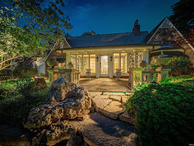 703 Pfeiffer Rd, Evansville, IN 47711 - back of house at twilight with a chimney
