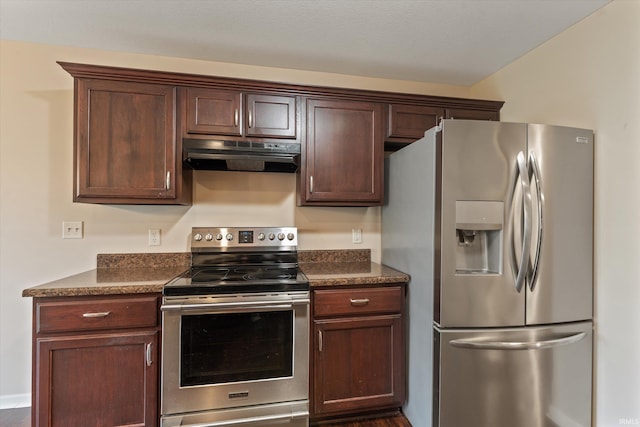 32840 Morning Dove Ct, New Carlisle, IN 46552 - kitchen with stainless steel appliances, under cabinet range hood, dark countertops, and dark brown cabinets