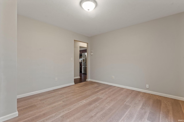 32840 Morning Dove Ct, New Carlisle, IN 46552 - unfurnished room with light wood-type flooring and baseboards