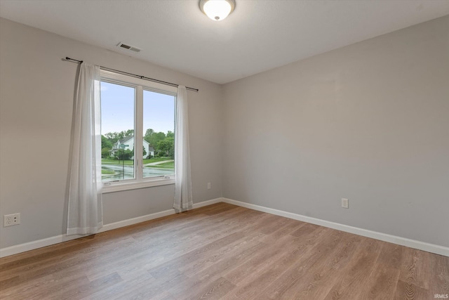 32840 Morning Dove Ct, New Carlisle, IN 46552 - spare room with light wood-style flooring and baseboards