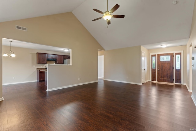 32840 Morning Dove Ct, New Carlisle, IN 46552 - unfurnished living room with high vaulted ceiling, ceiling fan, a chandelier, dark wood-style floors, and baseboards