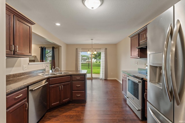 32840 Morning Dove Ct, New Carlisle, IN 46552 - kitchen featuring appliances with stainless steel finishes, a sink, a peninsula, dark wood finished floors, and under cabinet range hood