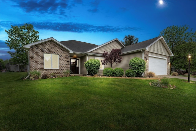 32840 Morning Dove Ct, New Carlisle, IN 46552 - ranch-style home with an attached garage, brick siding, a front lawn, and driveway