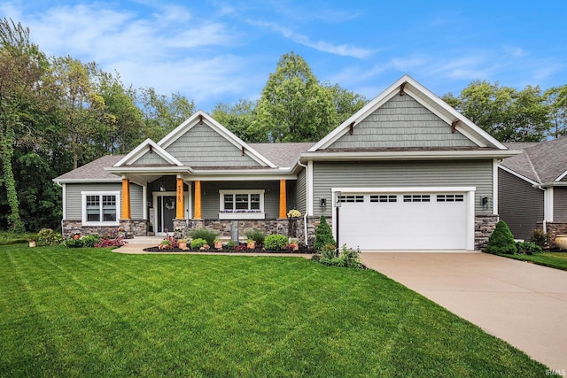 53760 Terre Verde Hills Ct, South Bend, IN 46628 - craftsman inspired home featuring a garage, stone siding, driveway, and a front yard