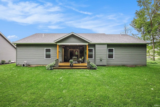 53760 Terre Verde Hills Ct, South Bend, IN 46628 - back of house featuring a wooden deck, a lawn, and roof with shingles