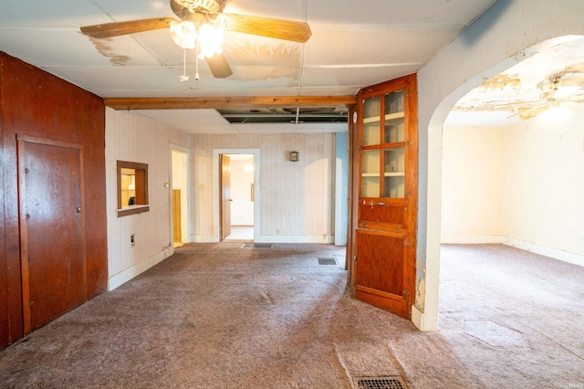 104 S Cowen St, Garrett, IN 46738 - carpeted spare room with arched walkways, ceiling fan, and baseboards