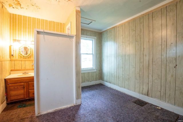 104 S Cowen St, Garrett, IN 46738 - unfurnished bedroom featuring carpet flooring, baseboards, attic access, and a sink