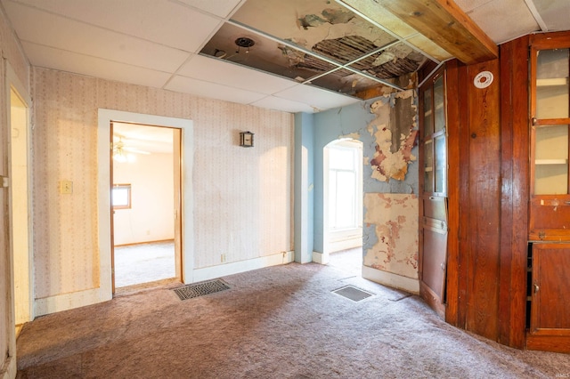 104 S Cowen St, Garrett, IN 46738 - empty room with wallpapered walls, carpet floors, arched walkways, and baseboards