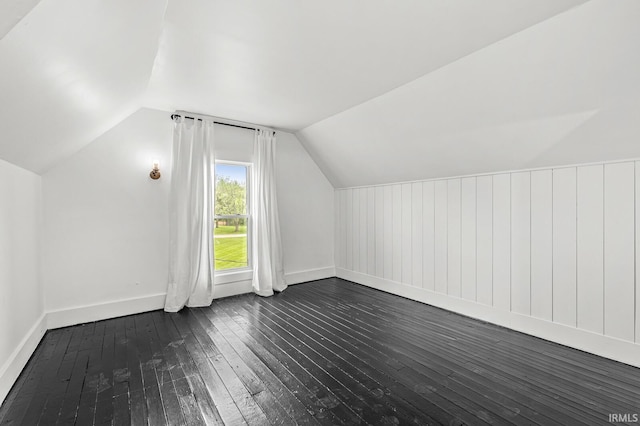 1258 N Main St, Nappanee, IN 46550 - additional living space featuring dark wood finished floors, vaulted ceiling, and baseboards