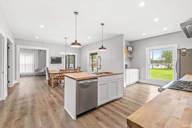 1258 N Main St, Nappanee, IN 46550 - kitchen with stainless steel appliances, butcher block countertops, a sink, plenty of natural light, and recessed lighting