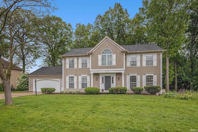 51695 Fox Pointe Ln, Granger, IN 46530 - view of front facade with an attached garage, driveway, and a front yard