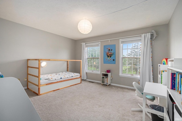 51695 Fox Pointe Ln, Granger, IN 46530 - carpeted bedroom with baseboards and a textured ceiling