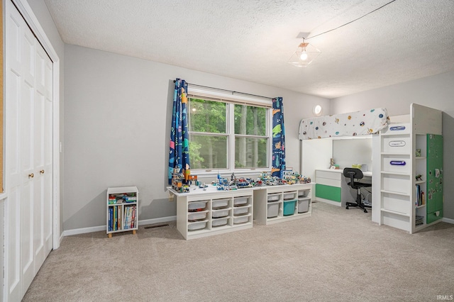 51695 Fox Pointe Ln, Granger, IN 46530 - rec room featuring carpet, a textured ceiling, and baseboards