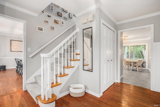 51695 Fox Pointe Ln, Granger, IN 46530 - stairs featuring wood finished floors, ornamental molding, and baseboards