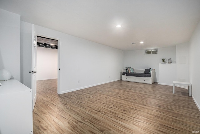 51695 Fox Pointe Ln, Granger, IN 46530 - unfurnished living room featuring light wood finished floors, recessed lighting, and baseboards