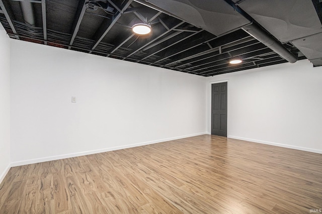51695 Fox Pointe Ln, Granger, IN 46530 - finished below grade area with light wood-style flooring and baseboards