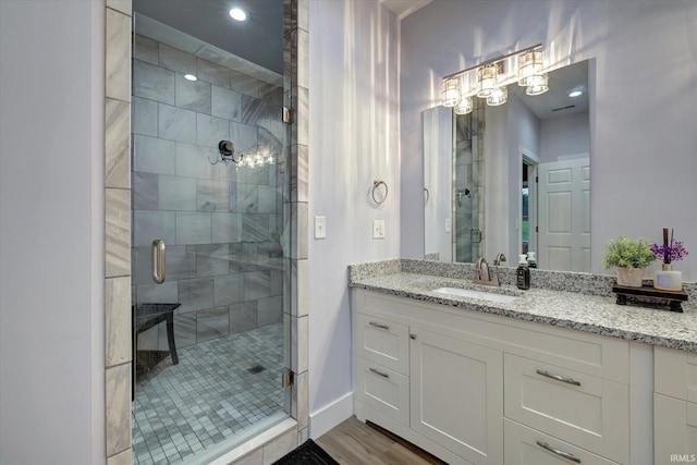 4022 Eagle Dr, Gosport, IN 47433 - bathroom featuring vanity, a shower stall, wood finished floors, and baseboards