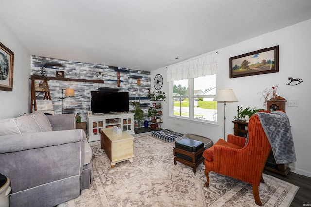 110 Alan Dr, Fremont, IN 46737 - living area with wood finished floors and an accent wall
