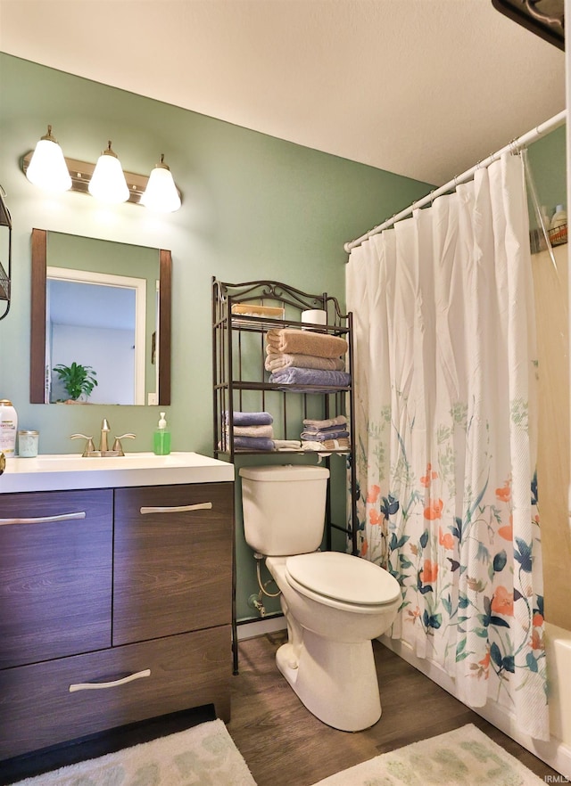 110 Alan Dr, Fremont, IN 46737 - full bath featuring wood finished floors, vanity, toilet, and shower / bathtub combination with curtain