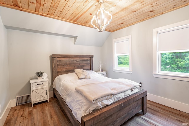 1471 Vernon St, Wabash, IN 46992 - bedroom featuring wooden ceiling, multiple windows, baseboards, wood finished floors, and a chandelier