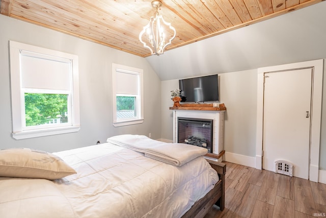 1471 Vernon St, Wabash, IN 46992 - bedroom featuring wood finished floors, wooden ceiling, a chandelier, a fireplace, and lofted ceiling