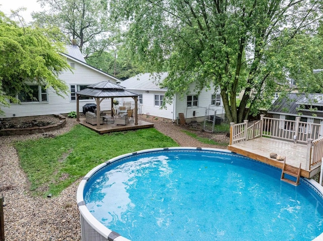 1471 Vernon St, Wabash, IN 46992 - outdoor pool featuring a gazebo, a deck, a lawn, and an outdoor living space