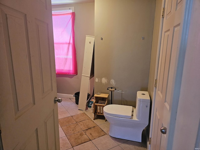 58 E 5th St, Peru, IN 46970 - bathroom featuring toilet and tile patterned floors