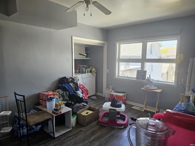 58 E 5th St, Peru, IN 46970 - interior space featuring washing machine and clothes dryer, wood finished floors, ceiling fan, and baseboards