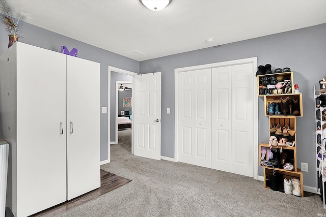 7228 W Mustang Dr, Ellettsville, IN 47429 - bedroom featuring carpet floors, a closet, and baseboards