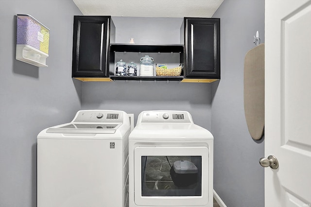 7228 W Mustang Dr, Ellettsville, IN 47429 - washroom featuring washer and dryer and cabinet space