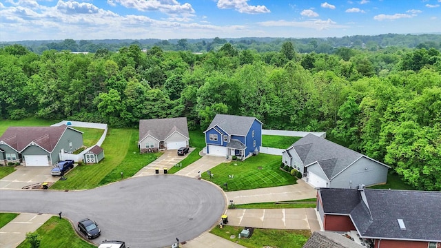 7228 W Mustang Dr, Ellettsville, IN 47429 - aerial view of residential area with a forest