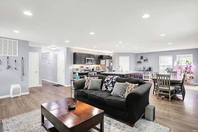7228 W Mustang Dr, Ellettsville, IN 47429 - living room featuring recessed lighting, light wood finished floors, and baseboards
